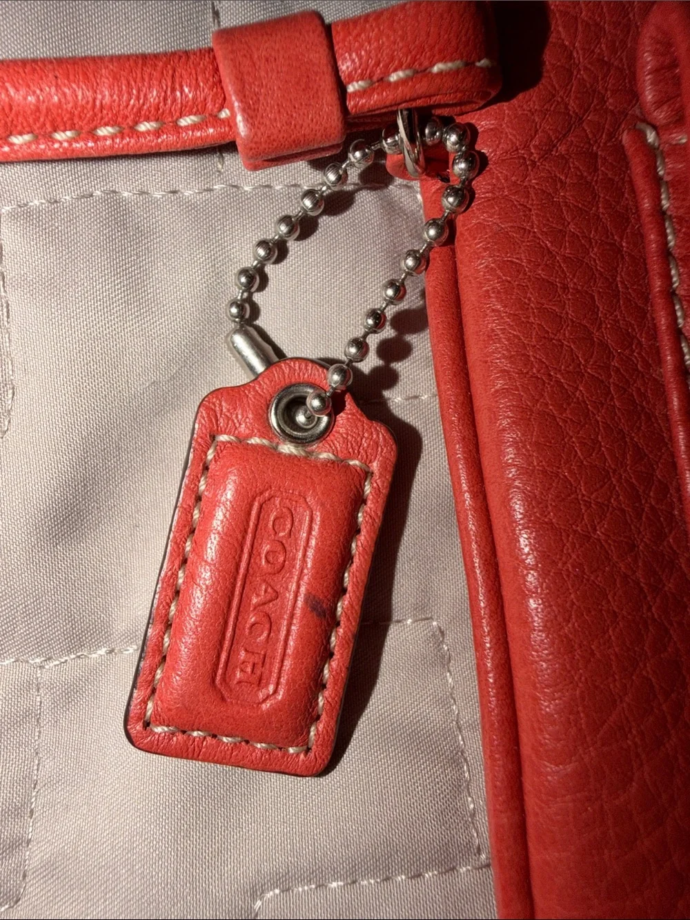Coach Hamilton Pebbled Leather Flap Wristlet in Geranium Coral